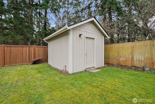 view of shed with a fenced backyard