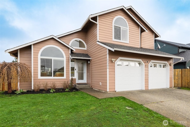 view of front facade featuring a front yard, fence, an attached garage, a shingled roof, and concrete driveway