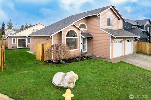 traditional-style home featuring concrete driveway, fence, a garage, and a front lawn