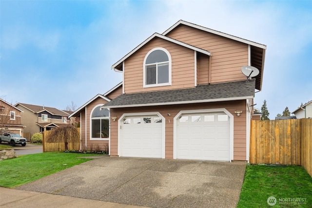 view of front of house with fence, concrete driveway, an attached garage, and a shingled roof