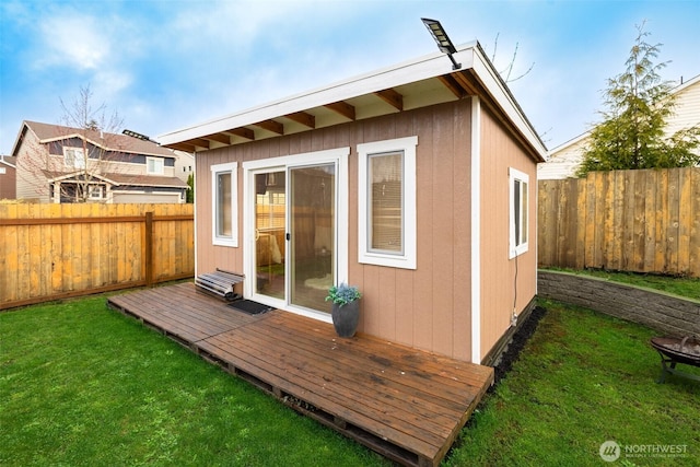 view of outdoor structure featuring a fenced backyard