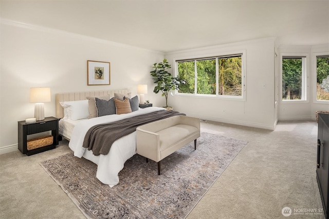 bedroom with baseboards, carpet floors, and ornamental molding