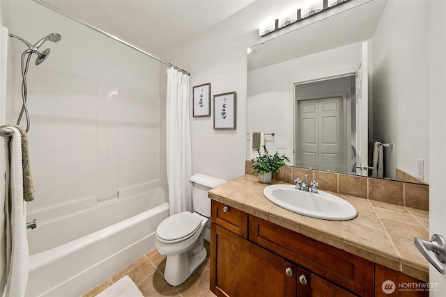 full bath with vanity, tile patterned floors, toilet, and shower / tub combo with curtain