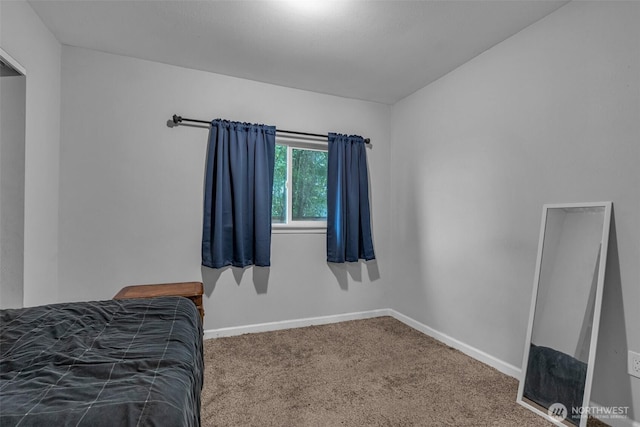 carpeted bedroom with baseboards