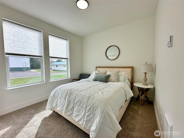 bedroom with carpet flooring and baseboards