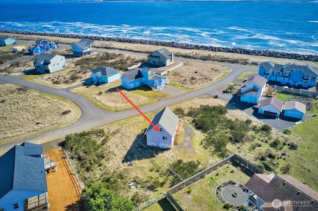 bird's eye view with a residential view and a water view