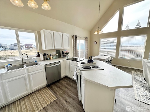 kitchen with a peninsula, stainless steel dishwasher, white cabinets, white electric stove, and a sink