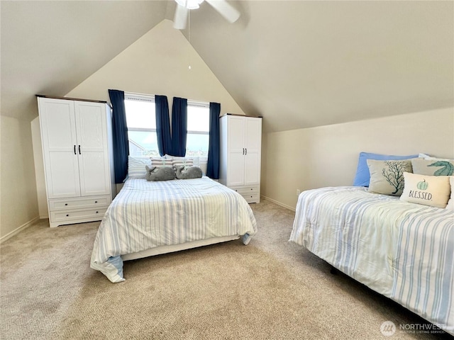 bedroom with lofted ceiling, a ceiling fan, baseboards, and light carpet