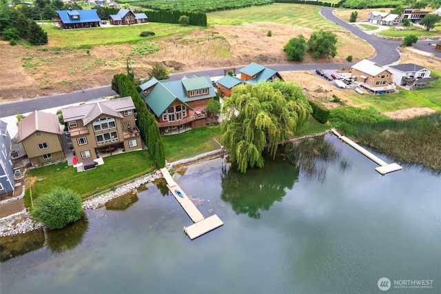 bird's eye view featuring a residential view and a water view