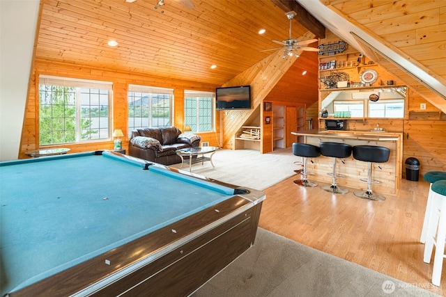 game room with wooden walls, beamed ceiling, wooden ceiling, wood finished floors, and billiards