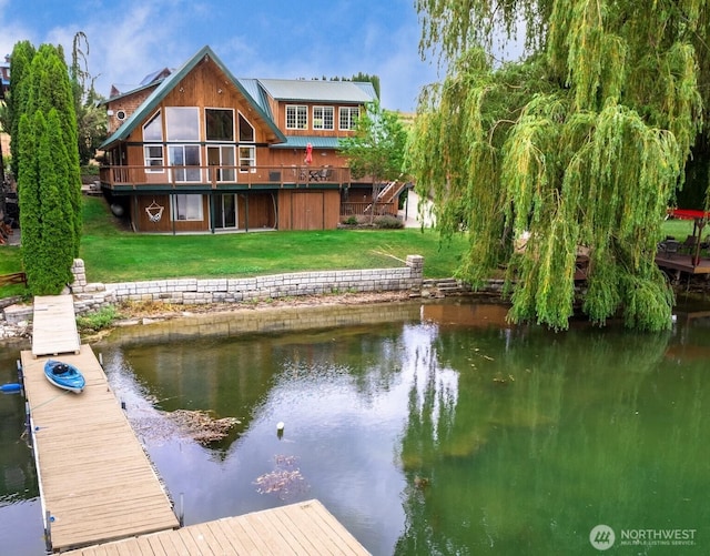 dock area featuring a yard and a water view