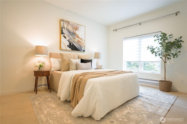 bedroom with a baseboard heating unit, baseboards, and light carpet