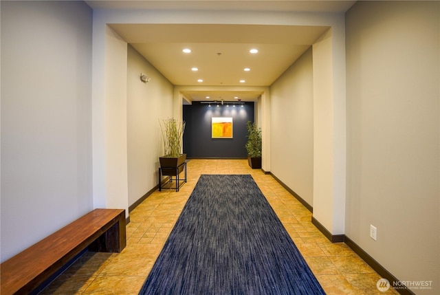 corridor featuring recessed lighting and baseboards