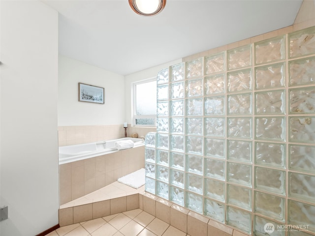 full bathroom with tile patterned floors, a garden tub, and a walk in shower