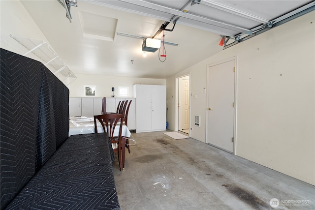 garage with visible vents and a garage door opener