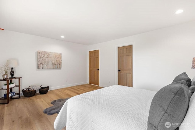 bedroom featuring recessed lighting, baseboards, and light wood-style floors