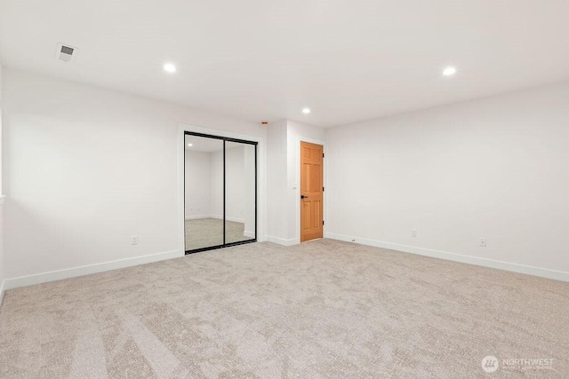 unfurnished bedroom featuring visible vents, baseboards, recessed lighting, a closet, and carpet flooring