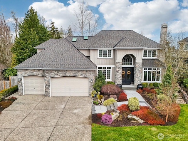 view of front of property featuring fence, roof with shingles, an attached garage, a chimney, and concrete driveway