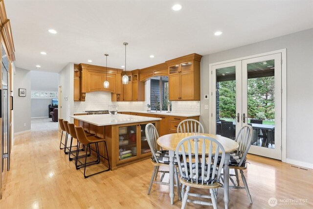 dining space featuring visible vents, recessed lighting, french doors, and light wood-type flooring