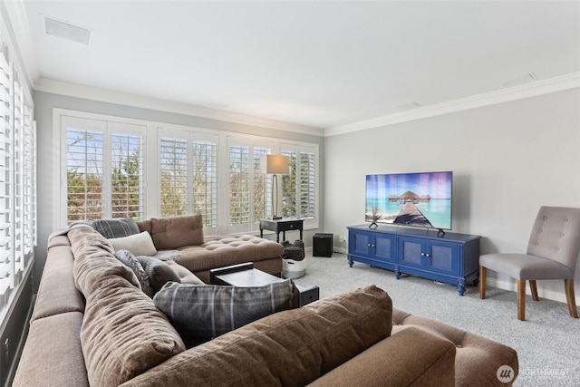 carpeted living room featuring visible vents, baseboards, and ornamental molding