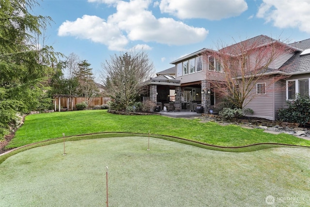 view of yard with fence and a patio area