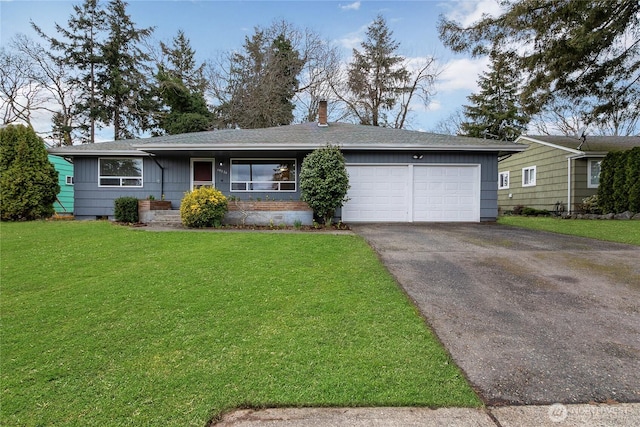 ranch-style home featuring a front yard, roof with shingles, a chimney, a garage, and aphalt driveway