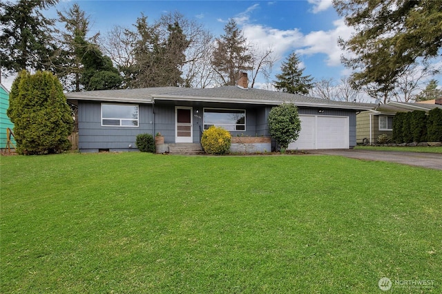 single story home with aphalt driveway, an attached garage, a chimney, and a front lawn