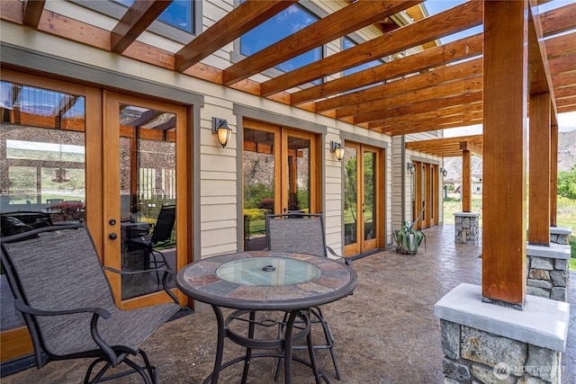 view of patio featuring french doors and outdoor dining area