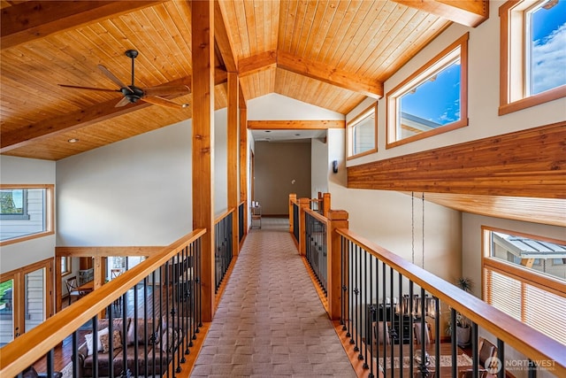 corridor with beamed ceiling, high vaulted ceiling, and wooden ceiling
