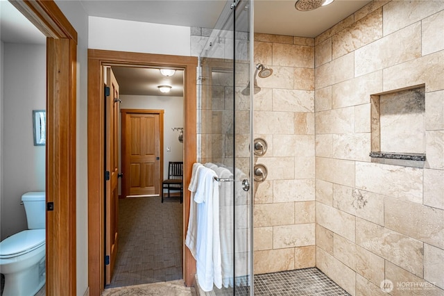 full bath with a shower stall and toilet