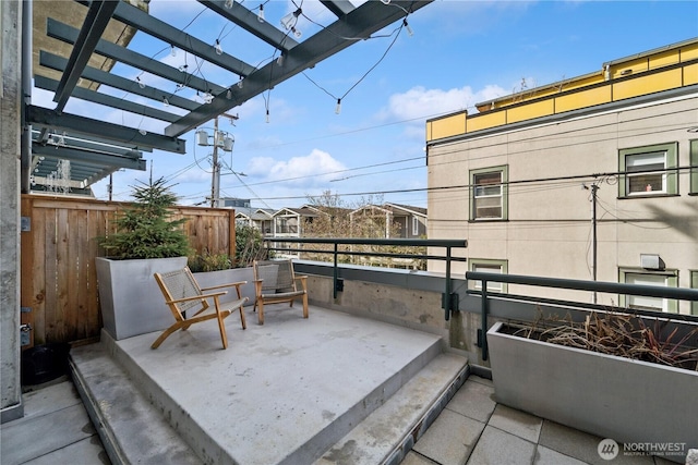 view of patio / terrace featuring a balcony and a pergola