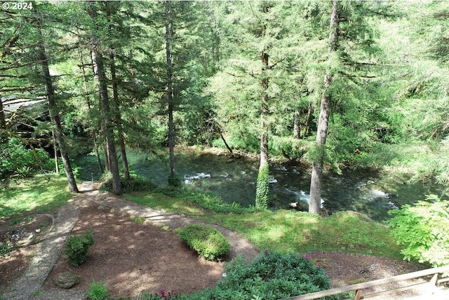 view of landscape featuring a wooded view