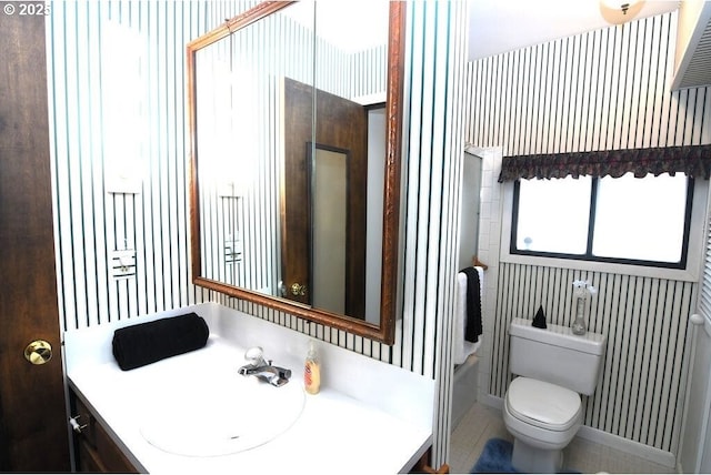 bathroom with toilet and vanity