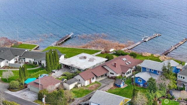 birds eye view of property featuring a residential view and a water view