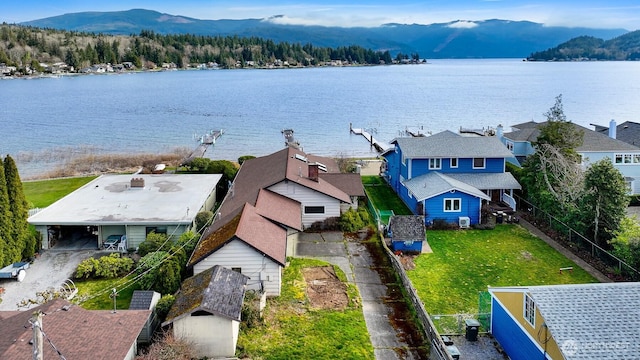 aerial view featuring a water and mountain view