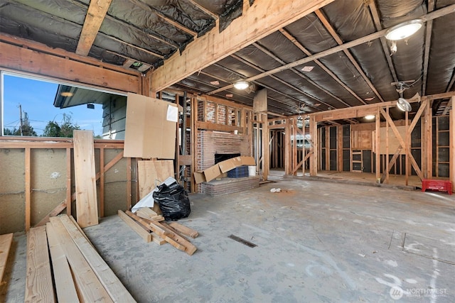 miscellaneous room with a brick fireplace