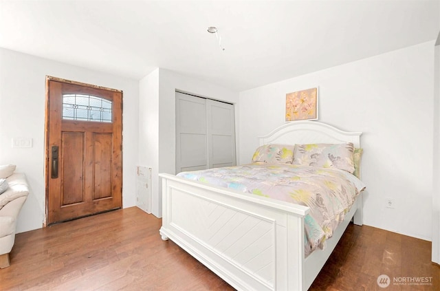 bedroom with wood finished floors