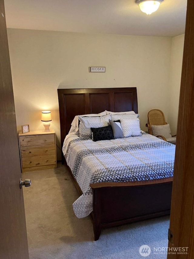 bedroom with light colored carpet