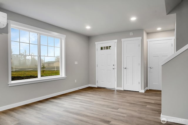 foyer entrance featuring recessed lighting, baseboards, and wood finished floors