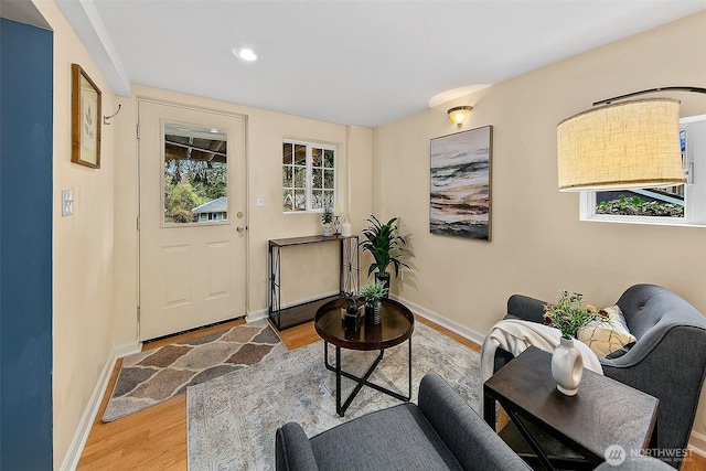 interior space featuring light wood-type flooring and baseboards