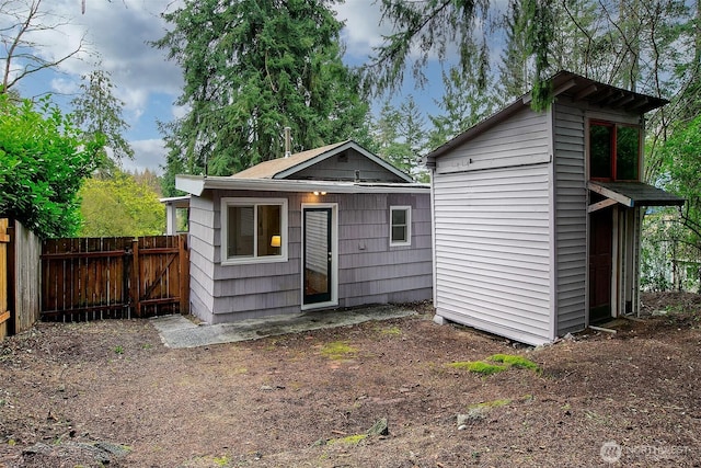 view of outdoor structure with an outdoor structure and fence