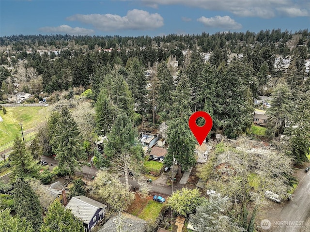 aerial view featuring a view of trees