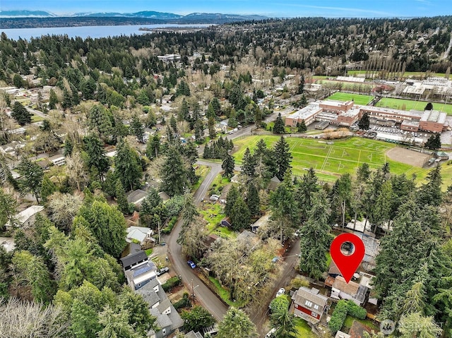 birds eye view of property with a water view