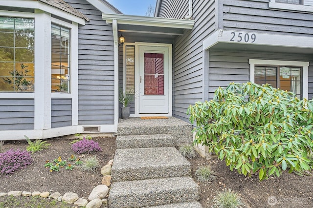 doorway to property featuring crawl space