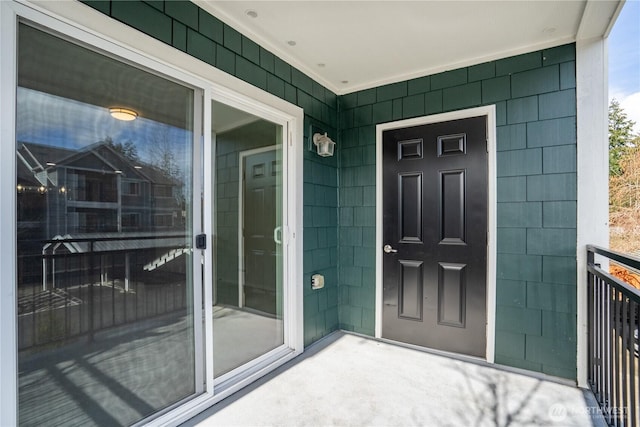 view of exterior entry featuring a porch