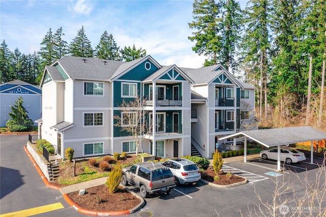 view of front of house with covered and uncovered parking