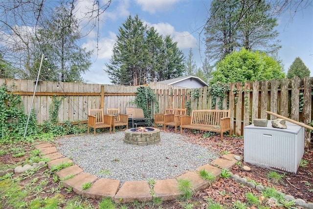 view of yard with a fire pit and a fenced backyard