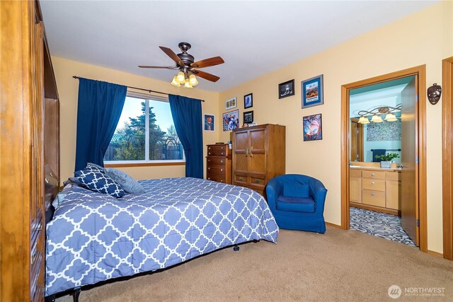 bedroom featuring ceiling fan, ensuite bathroom, and carpet