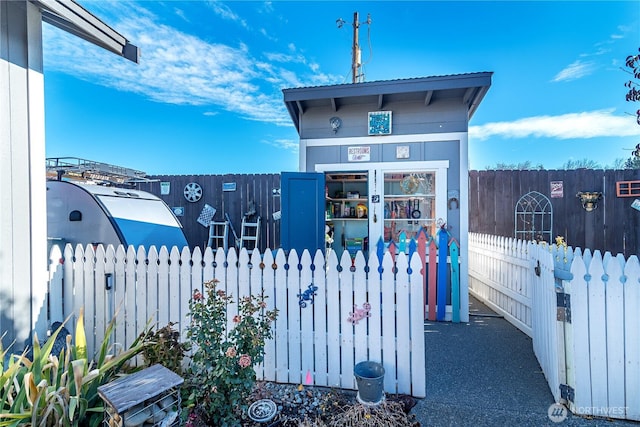 view of home's exterior featuring fence