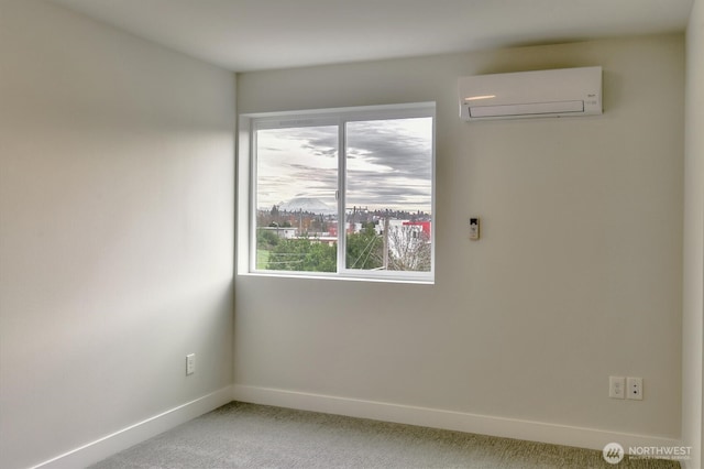 unfurnished room featuring carpet flooring, baseboards, and a wall mounted AC